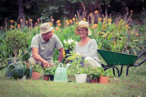 Gardener in Ickenham inspecting a community garden bed